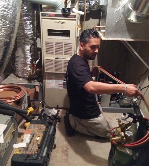 Mario Morales, founder of Wine Cellar Cooling Services Miami, is Welding the Refrigeration Lines for the Wine Cellar Beverly Hills Project