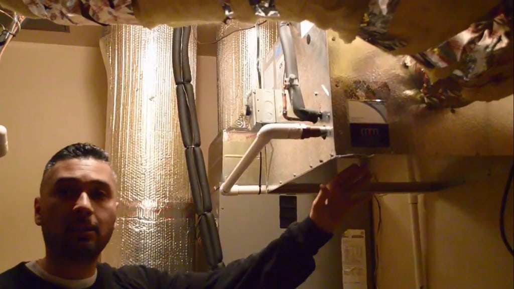Wine Cellar Cooling Services Miami HVAC team inspects a wine cellar cooling unit with refrigerant leak. 
